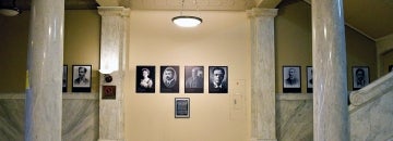 Wall in Lillian Massey Building with photos and portraits