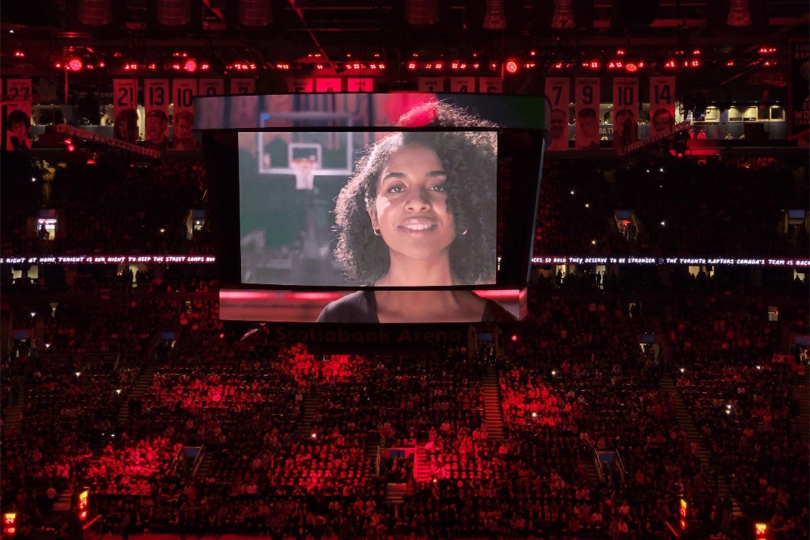 Hannah Flores on the big screen at a Raptors game