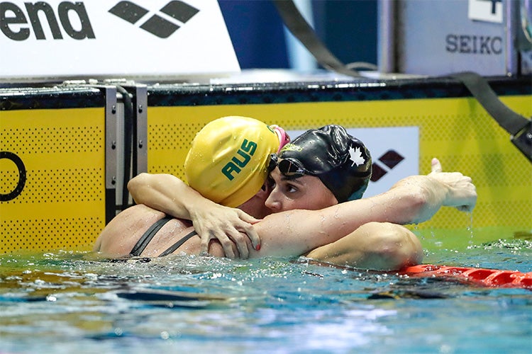  Kylie Massea is congratulated after winning the gold medal by silver medalist Emily Seebohm