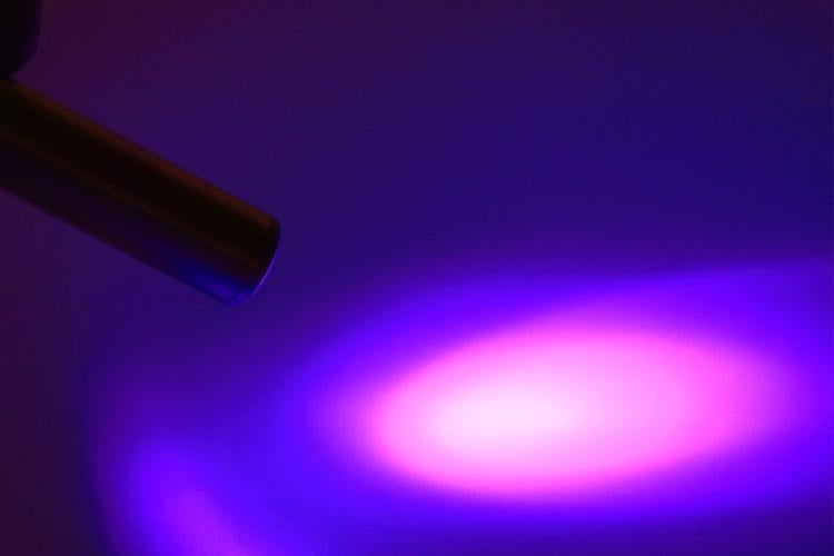 a UV light is shone on a desk
