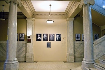 Wall in Lillian Massey Building with photos and portraits