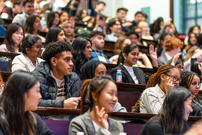 Students listen to an instructor in class