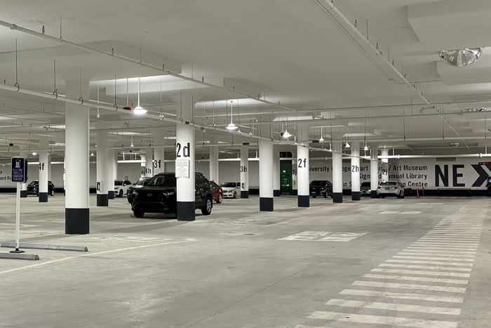 An underground new parking lot with a car in it