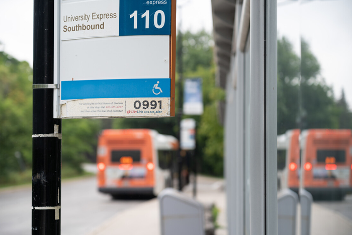 A bus stop in Mississauga with a bus in the distance