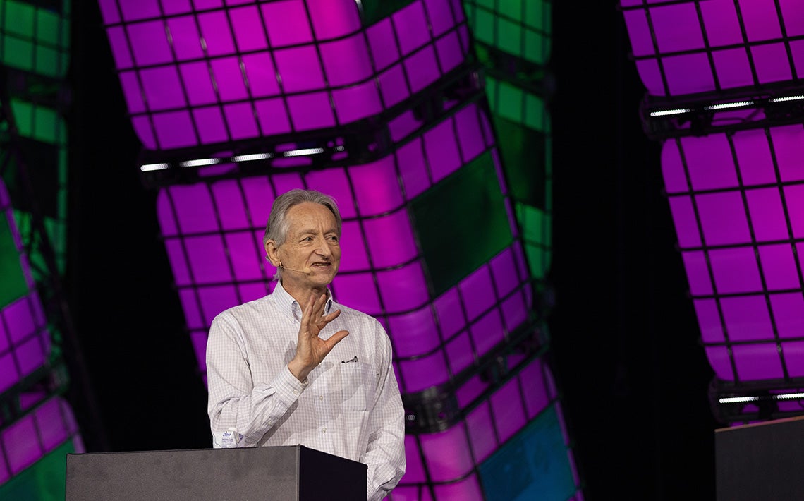 Geoffrey Hinton speaks at a tech conference