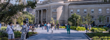 People walk outside Convocation Hall on St. George campus