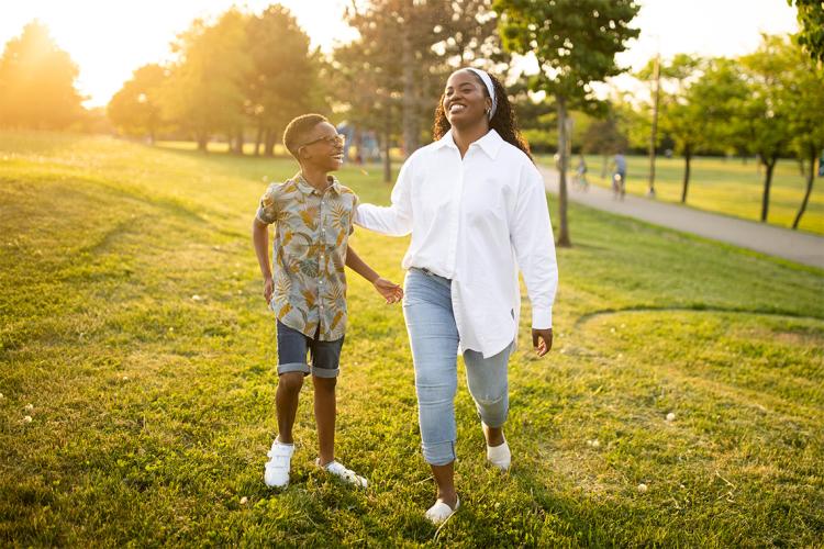 Thereasa and her son Romeo share a laugh in a park