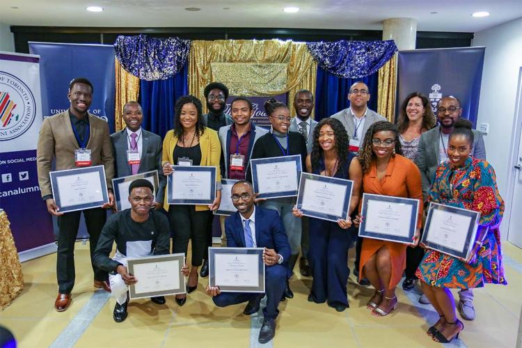 Group photo of the African Scholar awards winners holding up their awards