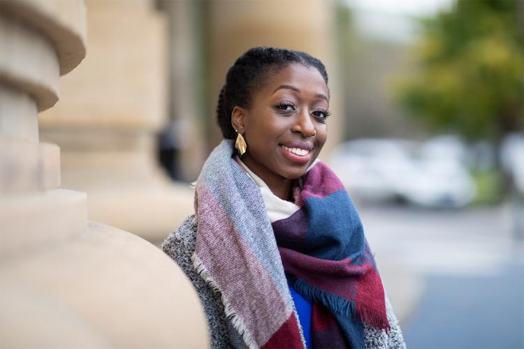 Kezia Amoako stands for a portrait outside Convocation Hall