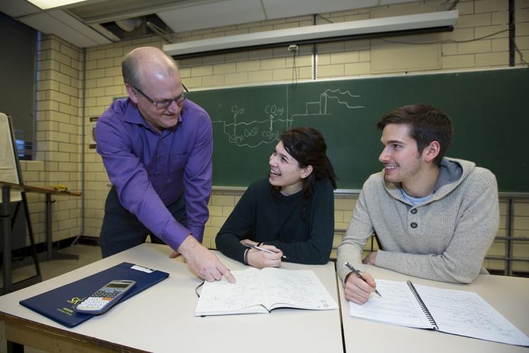 Photo of Greg Evans with students