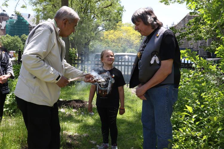 Elder Andrew Wesley, Roy Strebel and Roy's daughter during the garden's opening ceremony