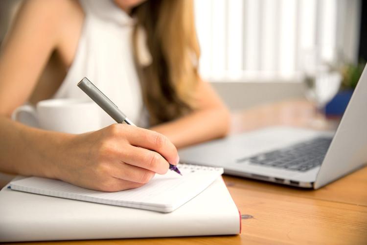 Photo of woman budgeting