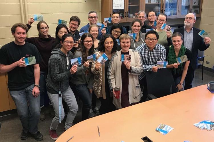 Photo of students with signed postcards