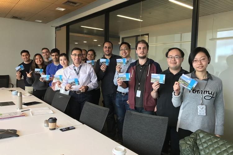 Photo of group with postcards