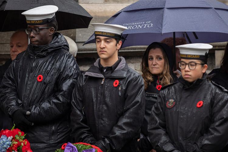 Photo of Chrystia Freeland standing under an umbrella