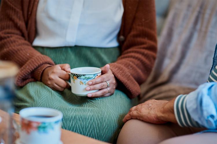 A woman holding a mug.