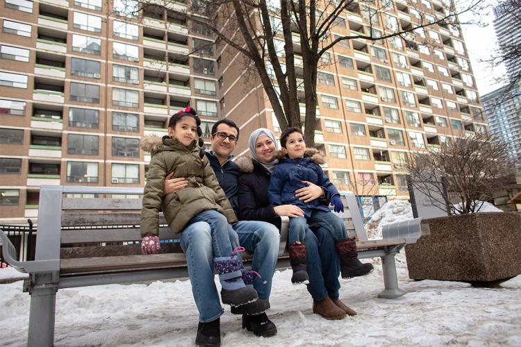 Master's candidate Yasmin Aboelzahab (centre, right) is pictured with her husband Samir, as well as their children Salma and Adam