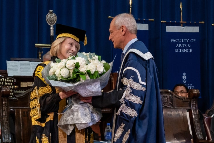 President Meric Gertler presents Chancellor Rose Patten with a bouquet at the conclusion of her 133rd convocation ceremony.  