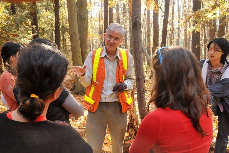 Rudy Boonstra teaches students in a forest
