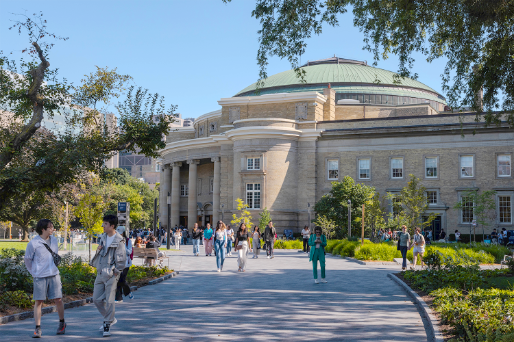 U of T community members walking outside of Convocation Hall