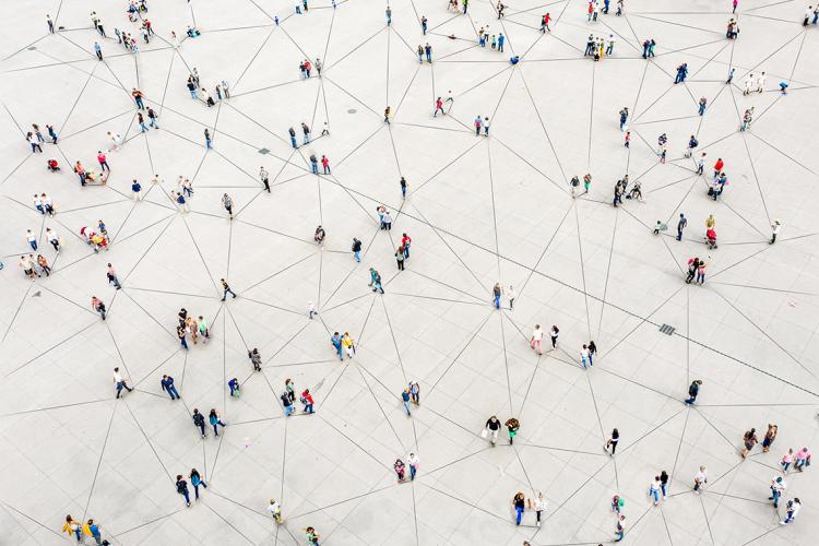 a large plaza with interconnected lines with groups of people on them