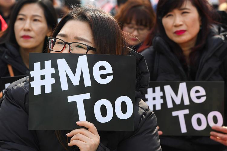 South Korean demonstrators hold banners during a rally to mark International Women's Day