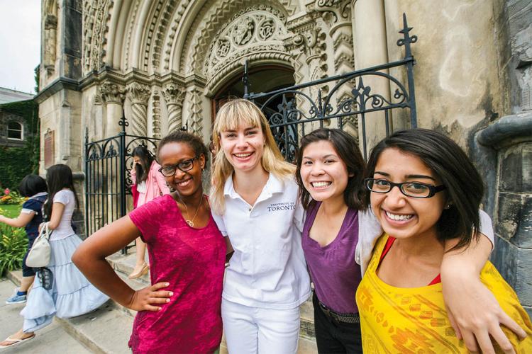 students with a tour guide at university college