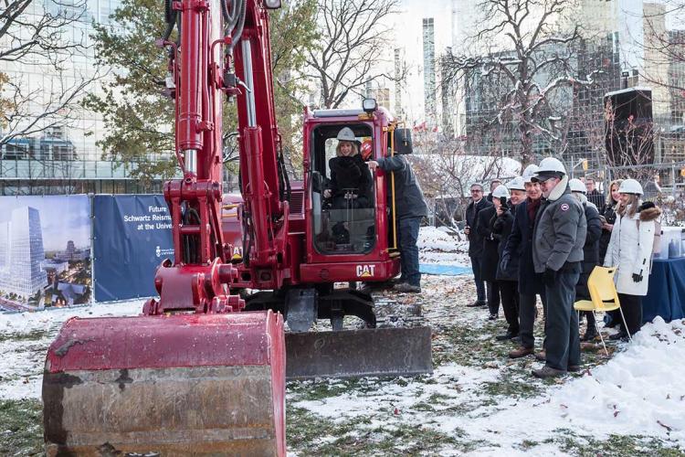 Heather Reisman operating a back hoe during the groundbreaking of the reisman schwartz innovation centre