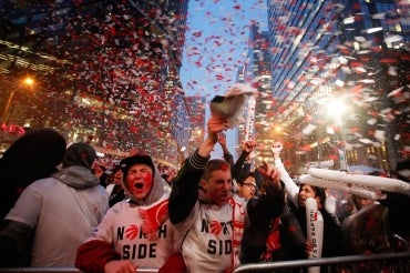 photo of fans celebrating outside Air Canada Centre during Raptors playoffs