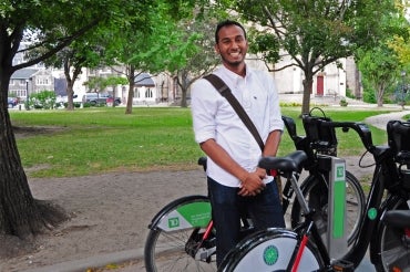 Photo of Suhal Ahmed standing near bike stand