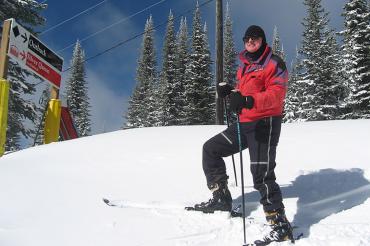 Photo of graduate John Horton on a ski hill