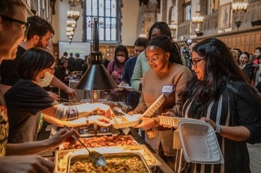 U of T community members line up for food at the Black History Month luncheon