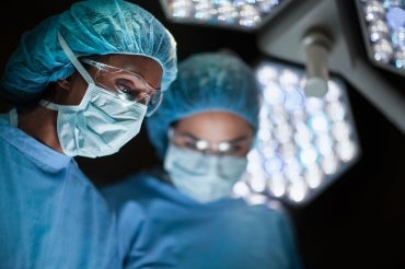 two female surgeons in an operating room