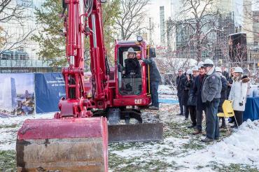 Heather Reisman operates a backhoe