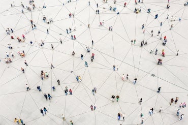 a large plaza with interconnected lines with groups of people on them