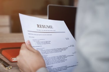 person holding a resume