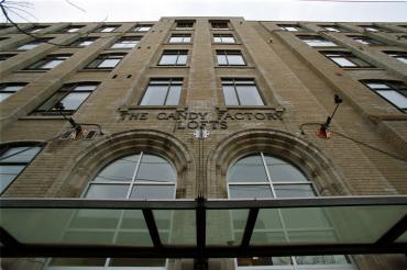 View of the exterior of the candy factory lofts and signage above main entrance