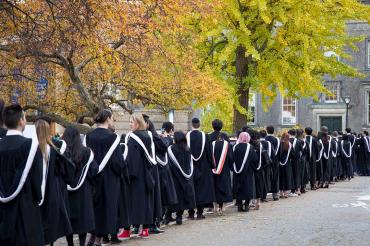 Students line up for fall convocation outside of convocation hall