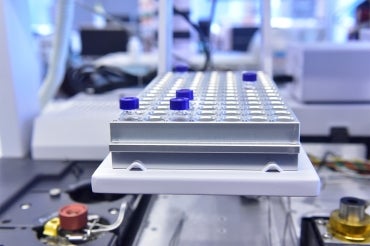 A tray of test tubes in a lab