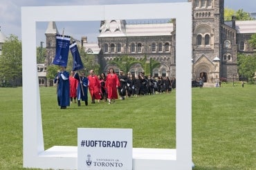 students on campus with the social frame during convocation