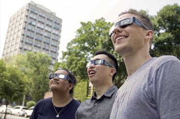 photo of students wearing eclipse glasses