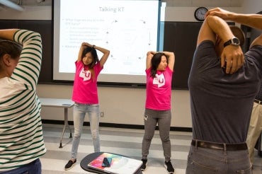 MoveU instructors lead a classroom movement break