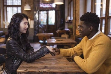 an east asian woman and a black man on a first date