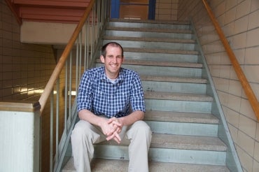 Geoffrey Wodtke sitting on a staircase