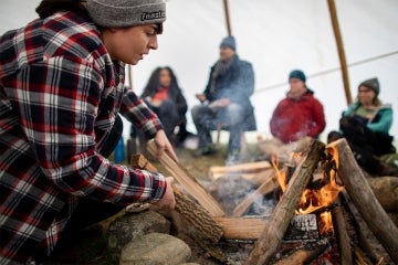 Photo of students building fire during course