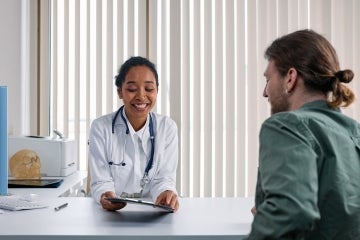 A doctor talking to a patient