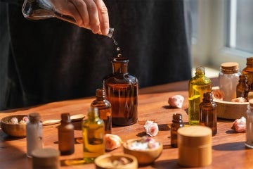 a person mixes various liquid ingredients into a bottle