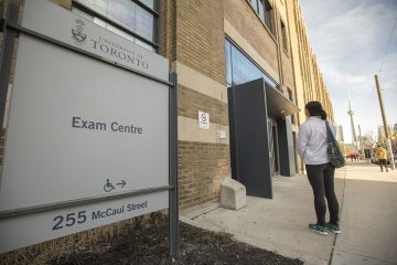 Photo of A. Zhang in front of the Exam Centre