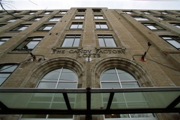 View of the exterior of the candy factory lofts and signage above main entrance