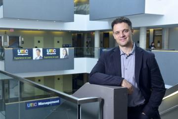 John Trougakos stands inside a building at University of Toronto Scarborough